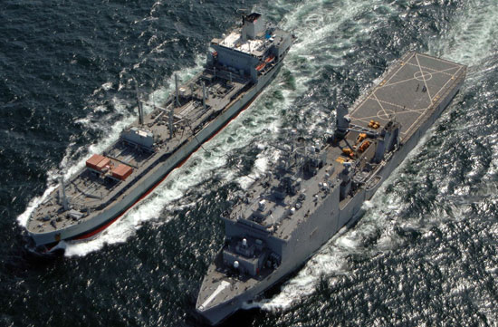 The amphibious dock landing ship USS Carter Hall (right) performs a replenishment at sea (RAS) with the Royal Fleet Auxiliary ship RFA Bayleaf (A 109). 