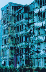 The devastating effect of a bomb on a building.