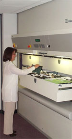 The Hanel Rotomat Office Carousel is an electronic computer controlled automated rack of shelves (Paternoster) that stores and retrieves files in seconds, at the command of the user.