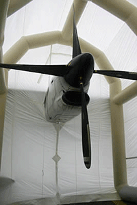 An inflatable maintenance shelter from J B Roche being used for propeller maintenance